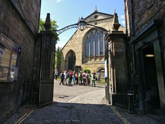 Inside Greyfriars Kirkyard Edinburgh facing Yellow Greyfriars Kirk